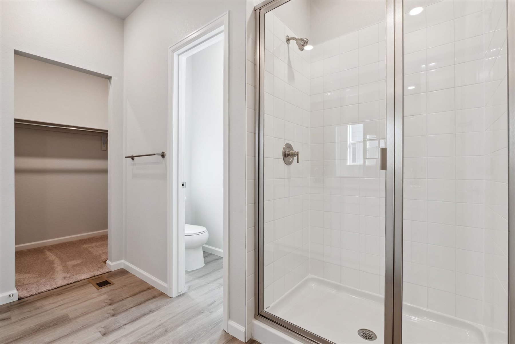 A bathroom with a glass shower.