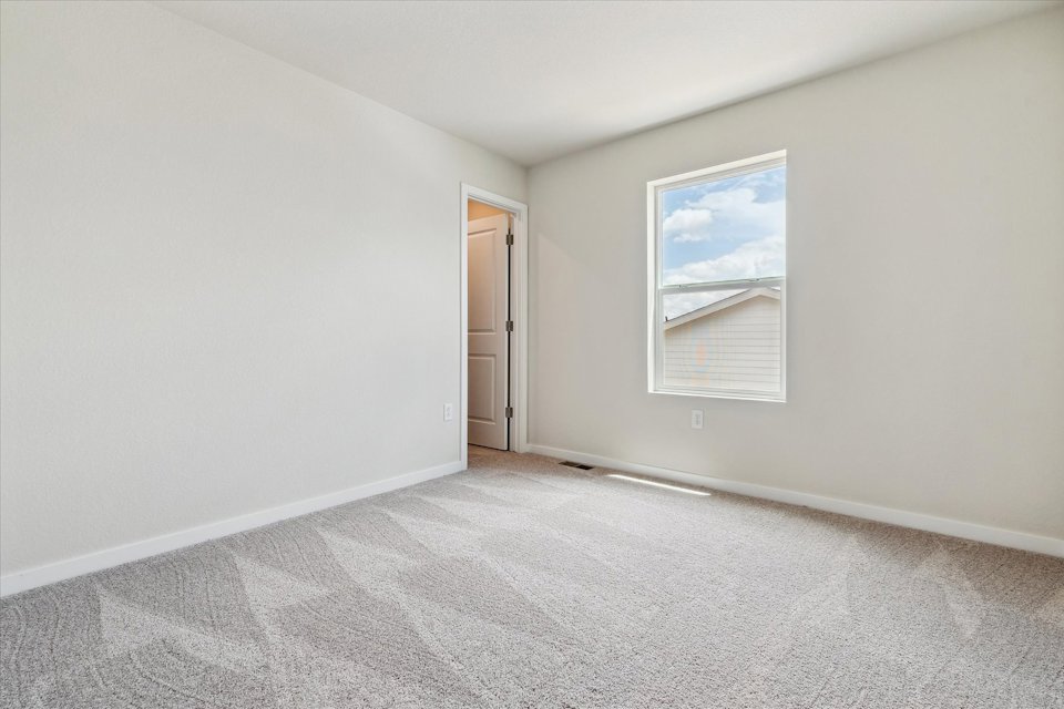 A hallway with a painting on the wall.