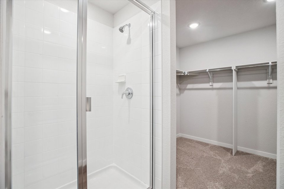A shower with a glass door.