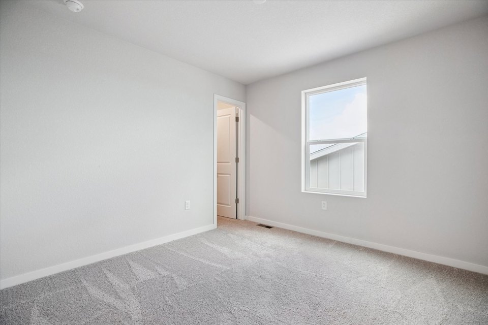 A room with a door and a window.