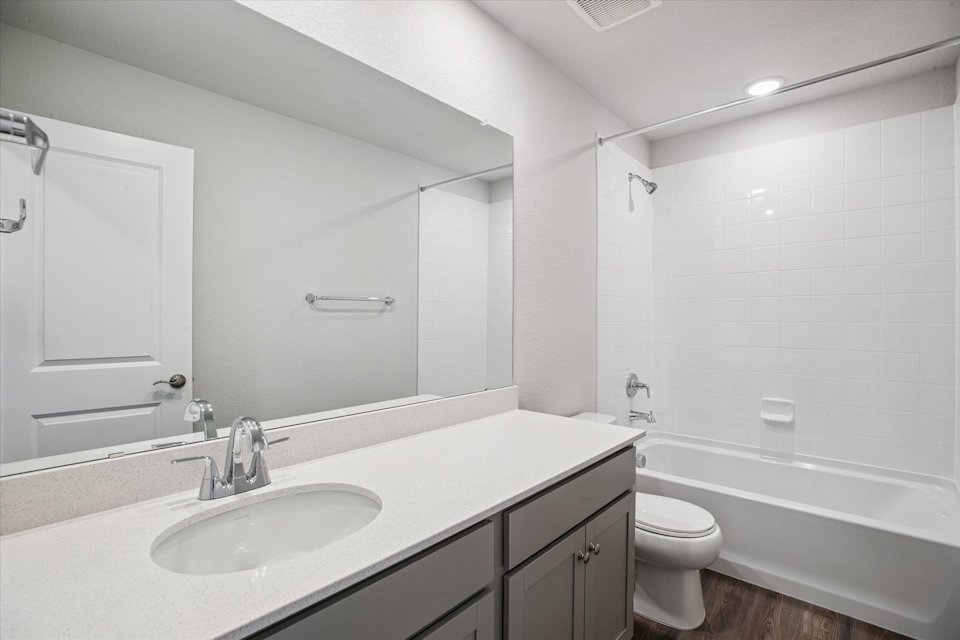 A bathroom with a sink and a toilet.
