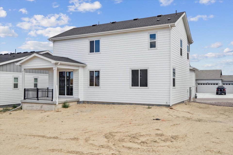 A house with a car parked in the driveway.