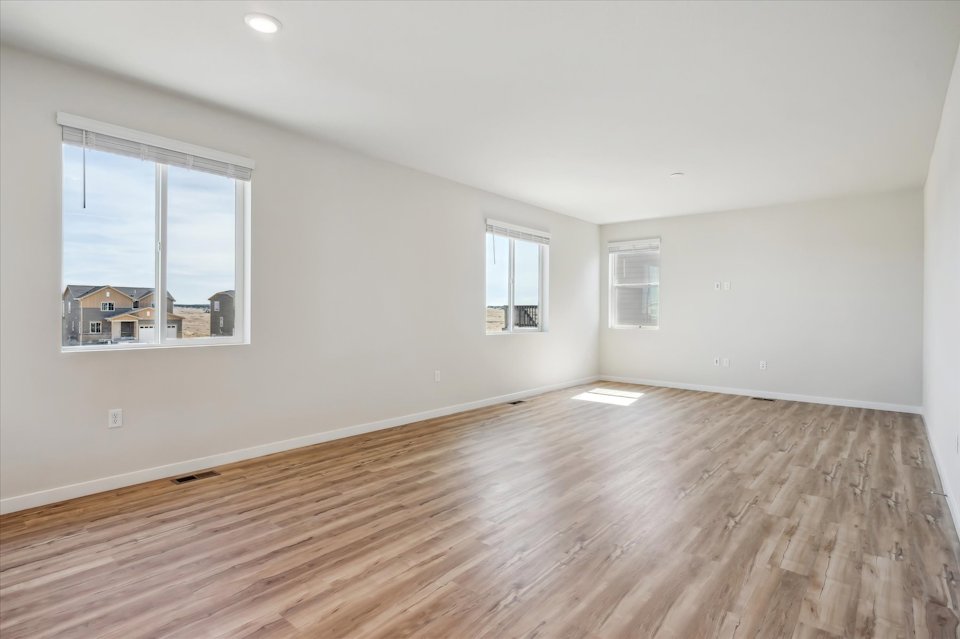 A room with a wood floor and a wood floor.
