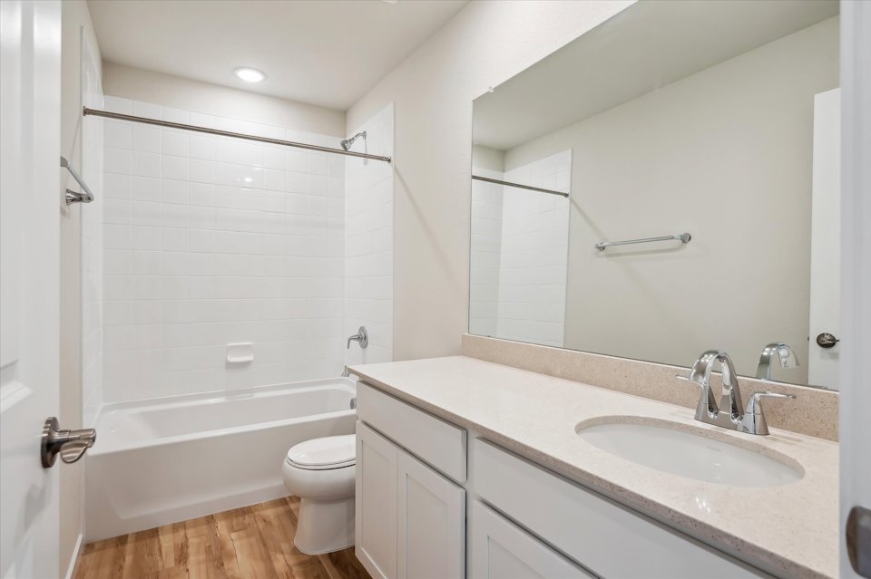 A bathroom with a sink and a toilet.