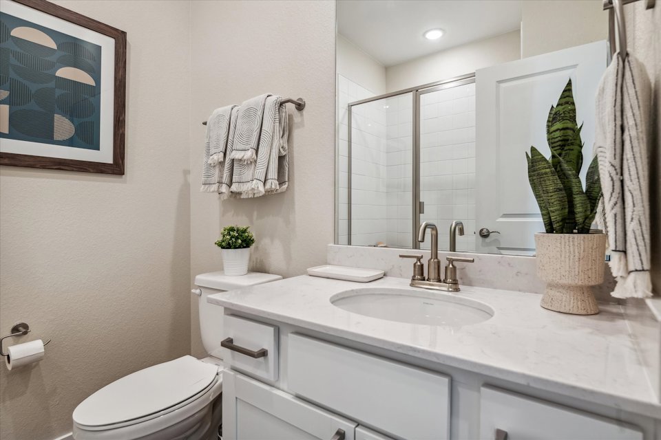 A bathroom with a sink and a mirror.
