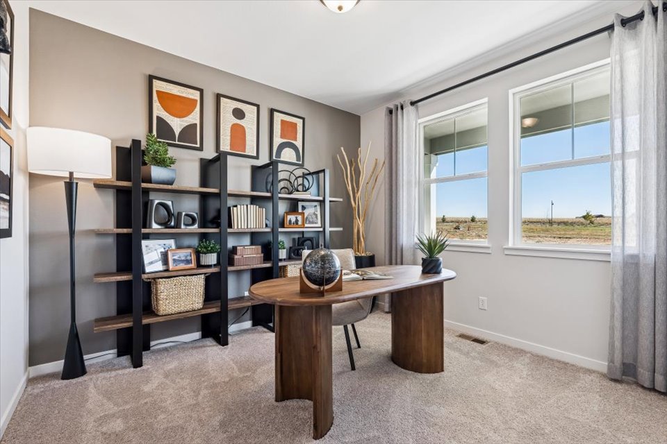 A room with a table and shelves.