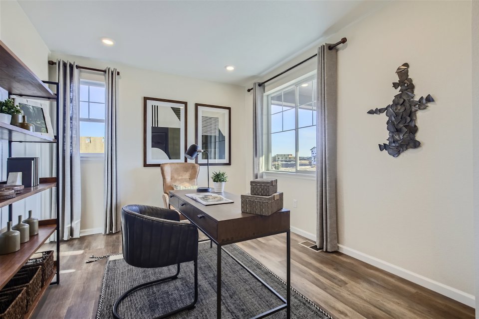 A room with a table and chairs.