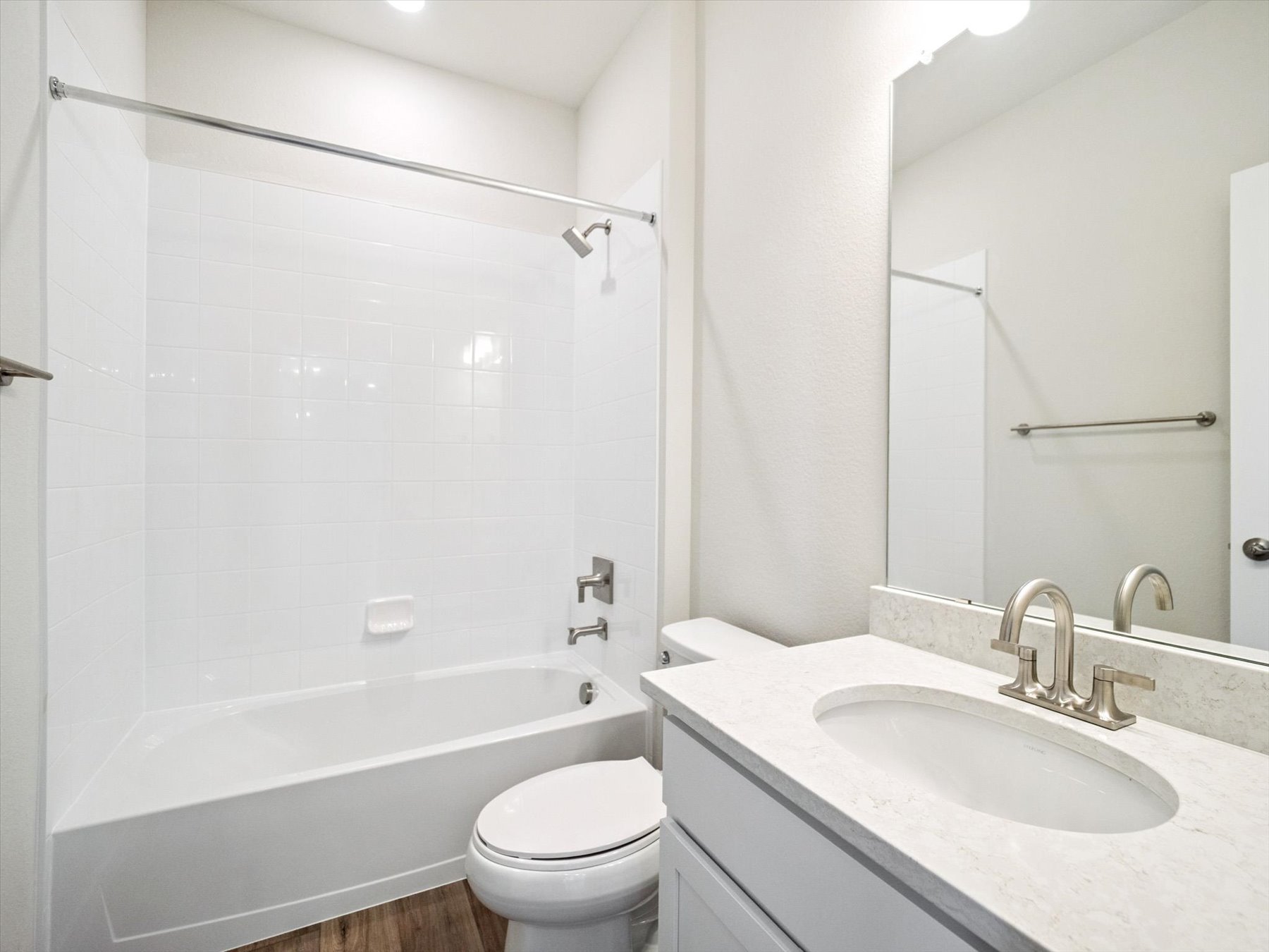 A bathroom with a sink and a toilet.