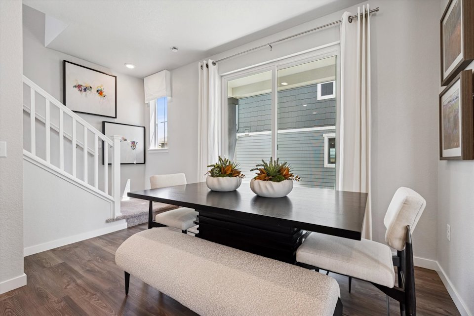 A room with a table and chairs.