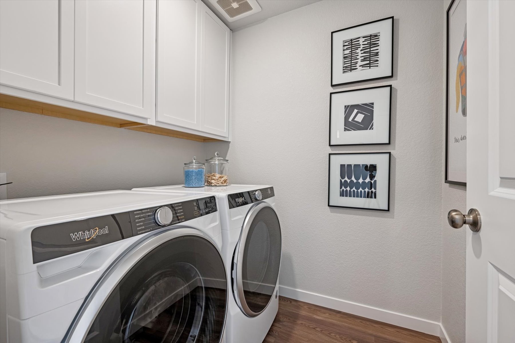 A washing machine in a room.