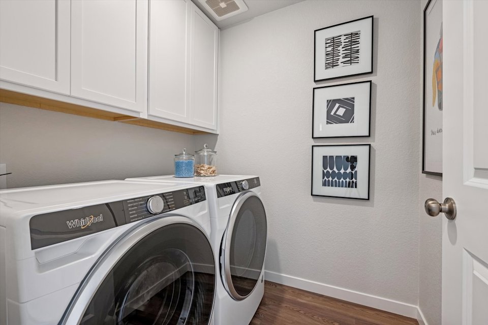 A washing machine in a room.