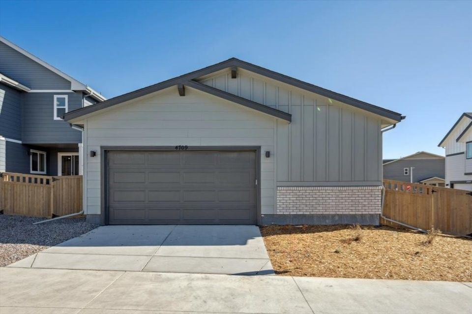 A garage with a fence.