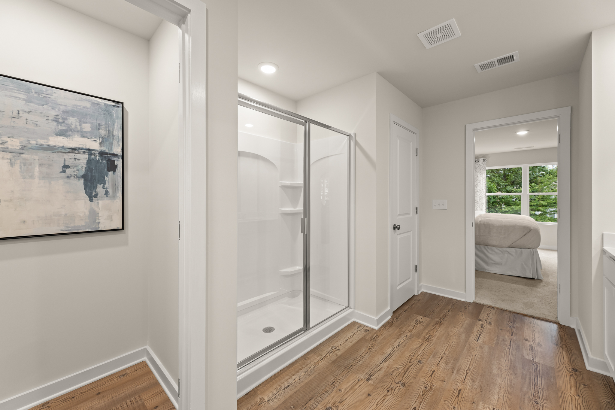 A room with a glass door and a glass wall.