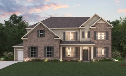 A large house with a lawn in front of it.