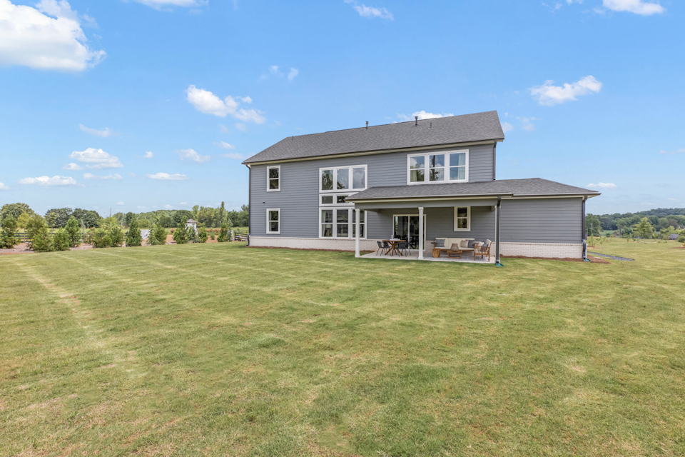 A house with a lawn in front.