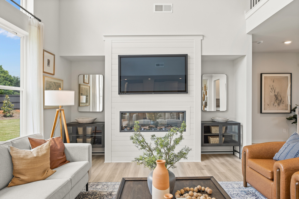 A living room with a fireplace.