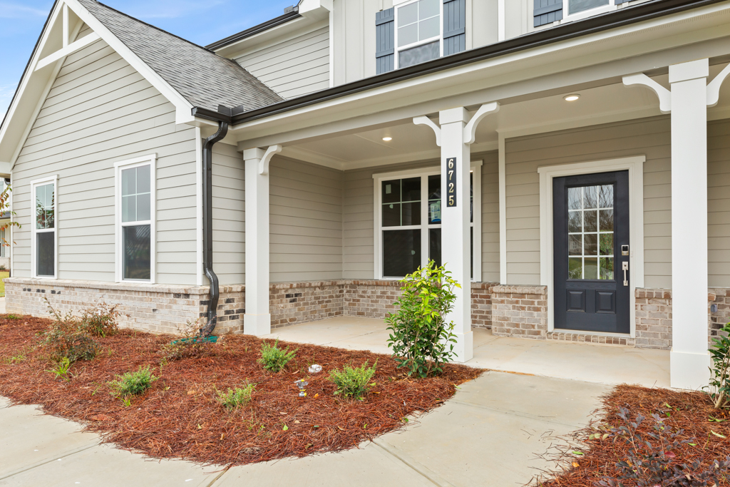 A white house with a front door.