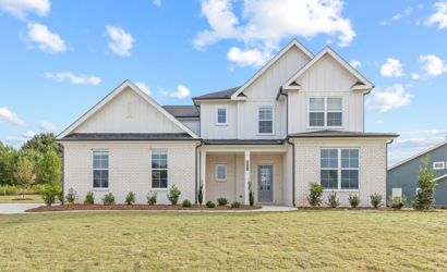 A house with a lawn in front.