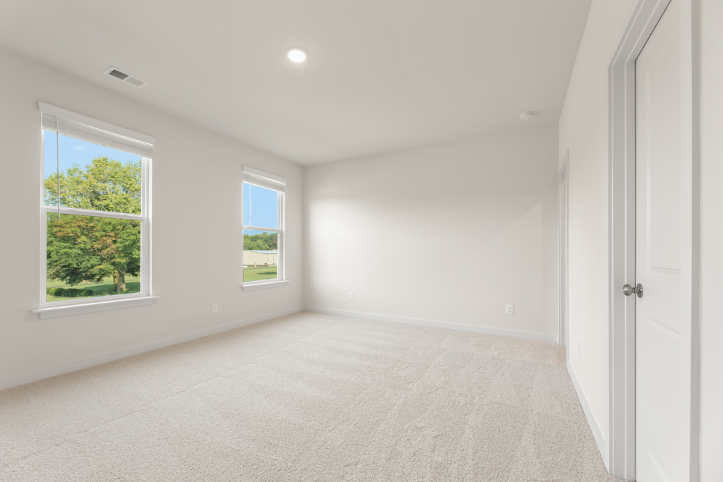 A room with windows and a door.