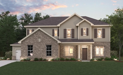 A large house with a lawn in front of it.