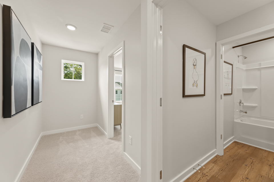 A bathroom with white walls.