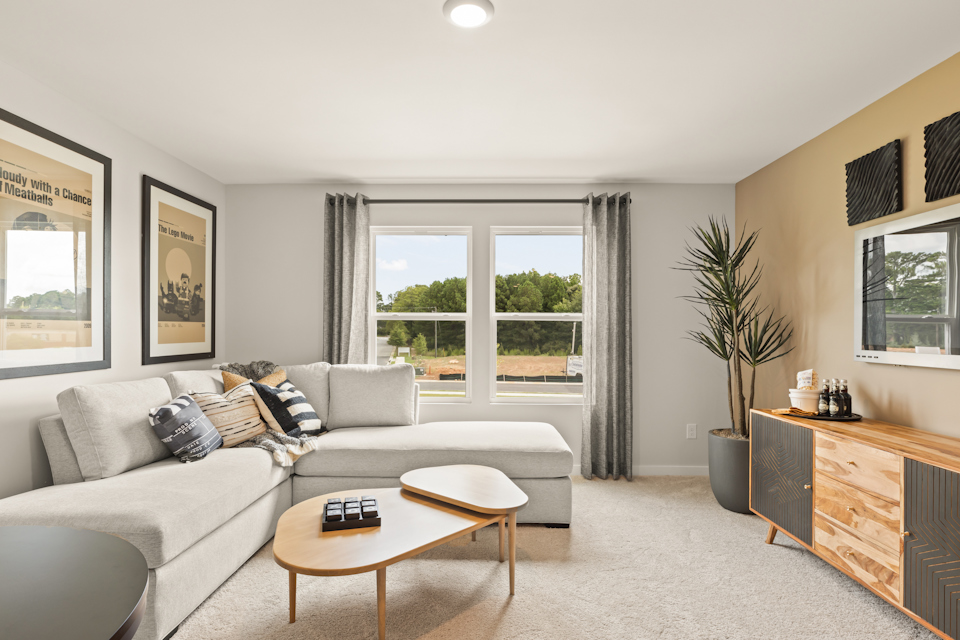 A living room with a couch and a coffee table.