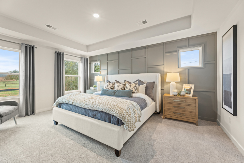 A bedroom with a large bed.