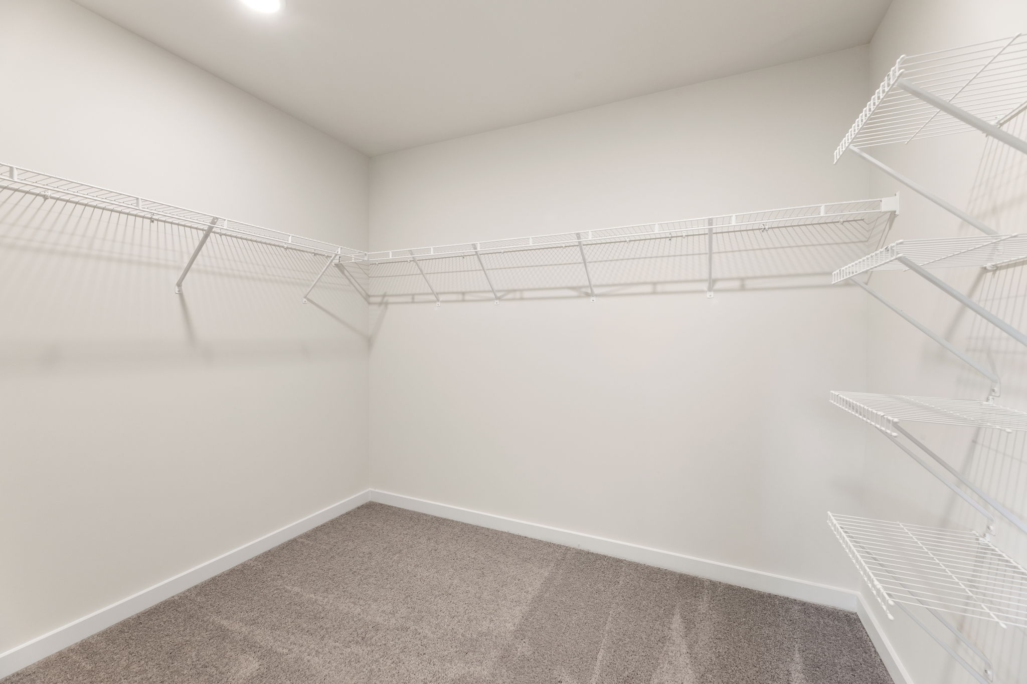 A white room with a staircase.