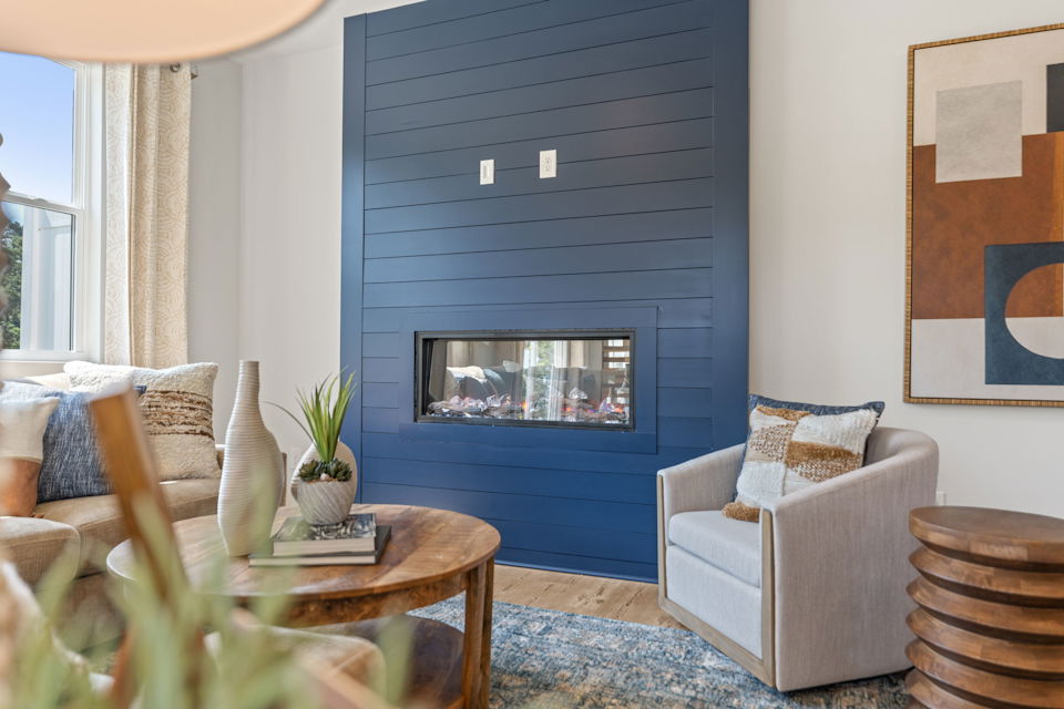 A living room with a fireplace.