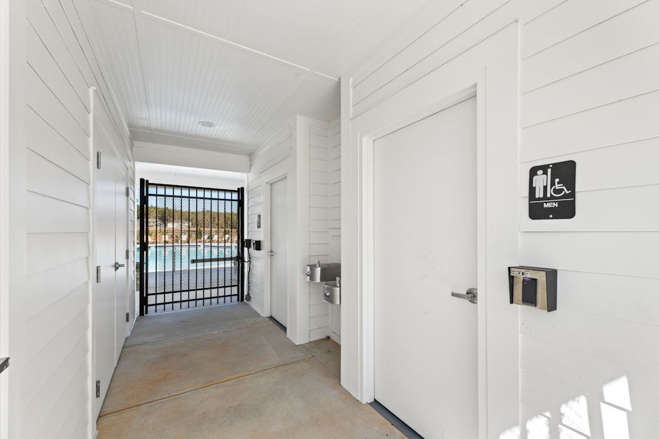 A hallway with white doors.