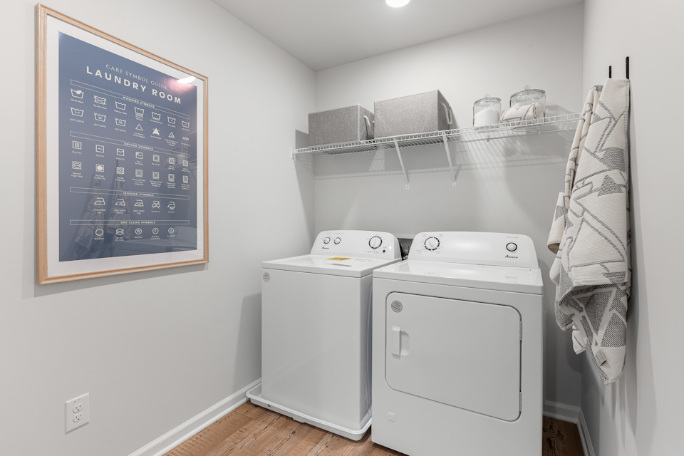 A laundry room with a chalkboard.