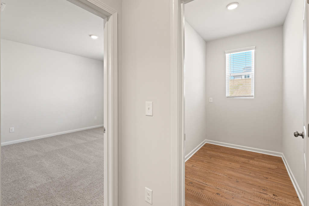A hallway with white walls.