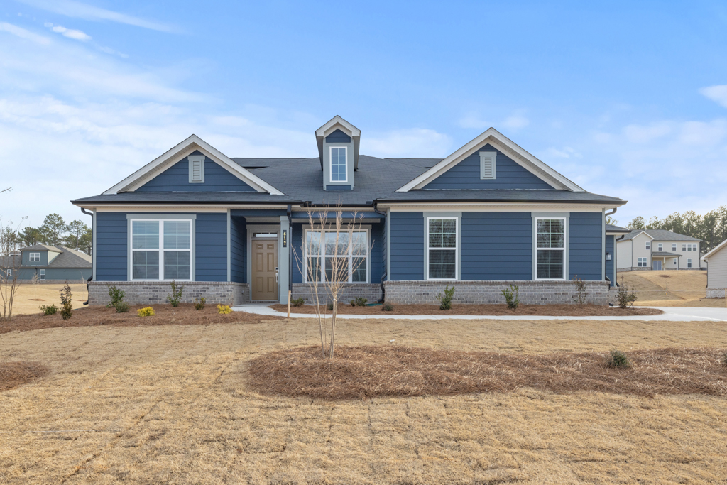 A house with a dirt yard.