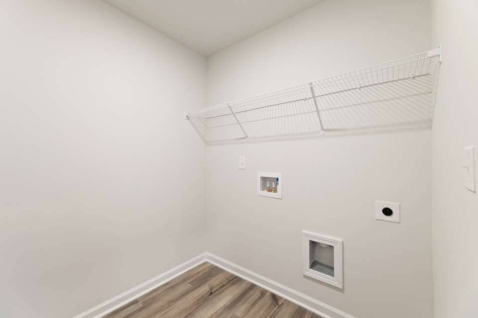A white room with a vent.
