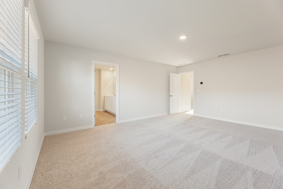 A long hallway with white walls.