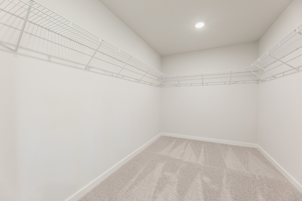 A white hallway with a white wall.