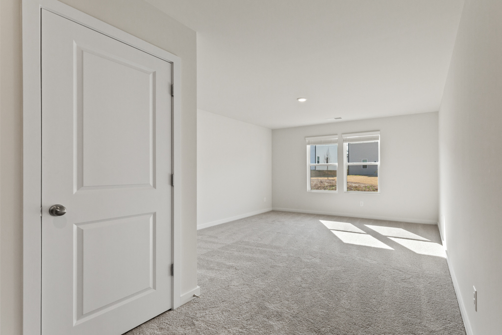 A room with a door and a window.