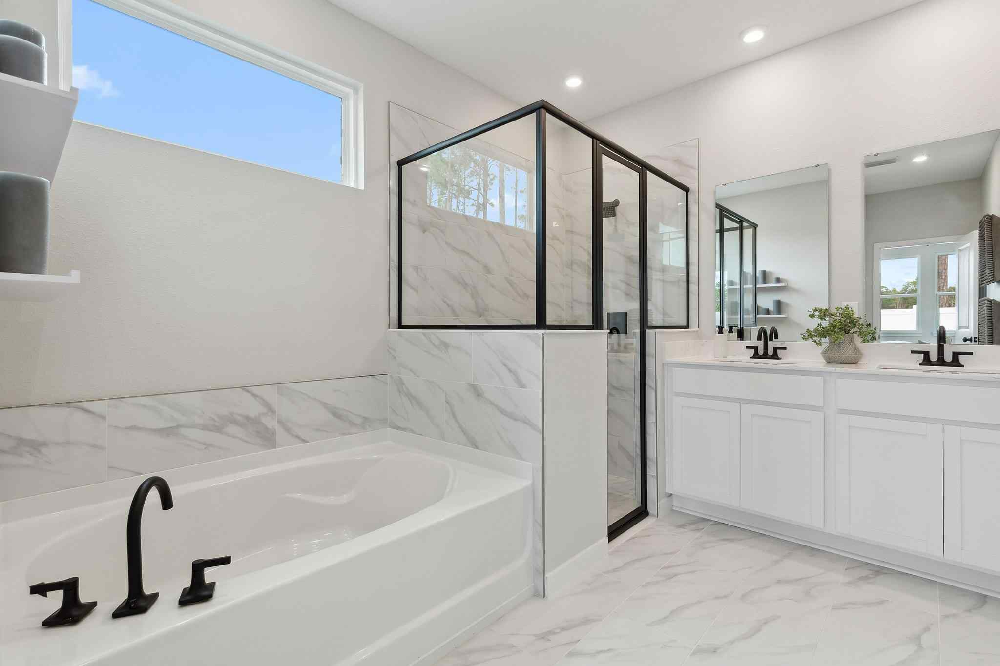 A bathroom with a tub and sink.