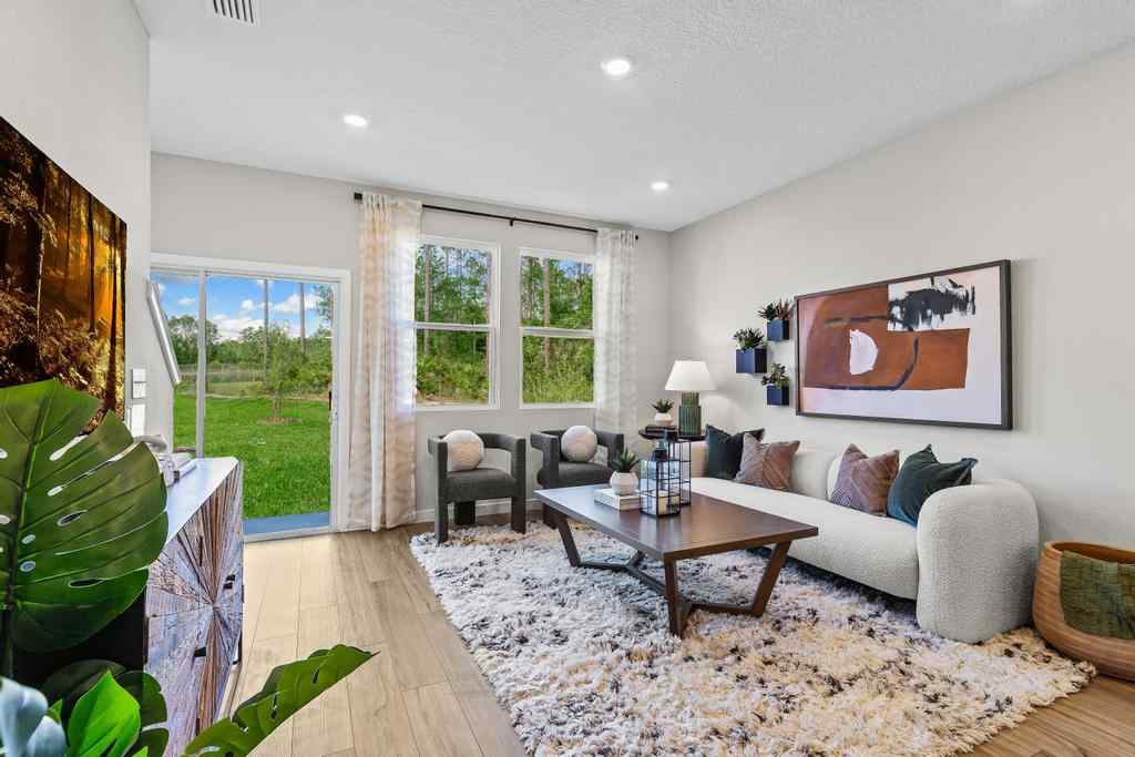 A living room with a couch and a table.