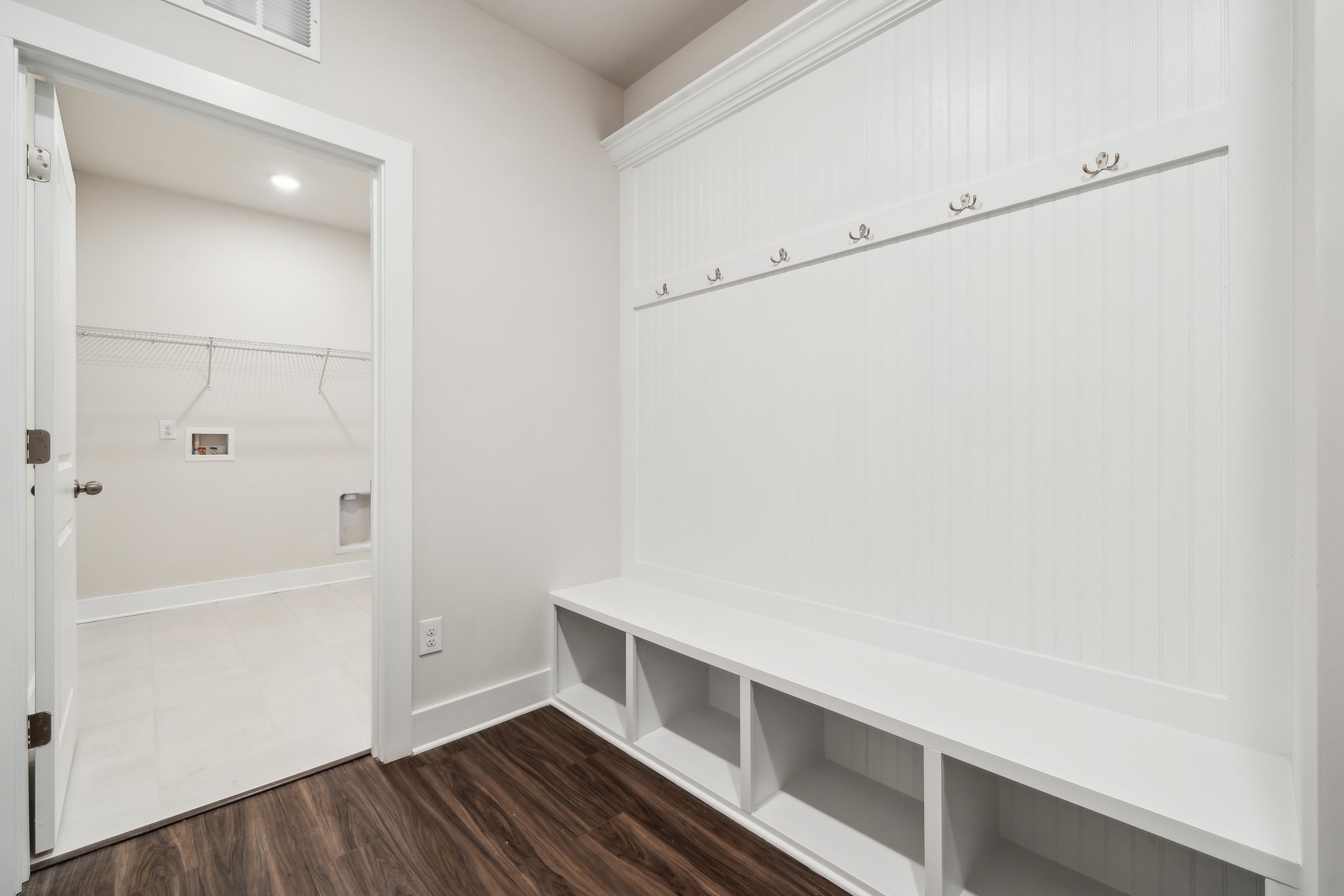 A white room with a white wall.