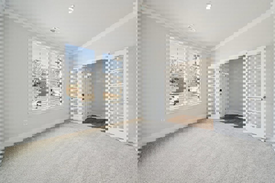 A room with a window and a door.