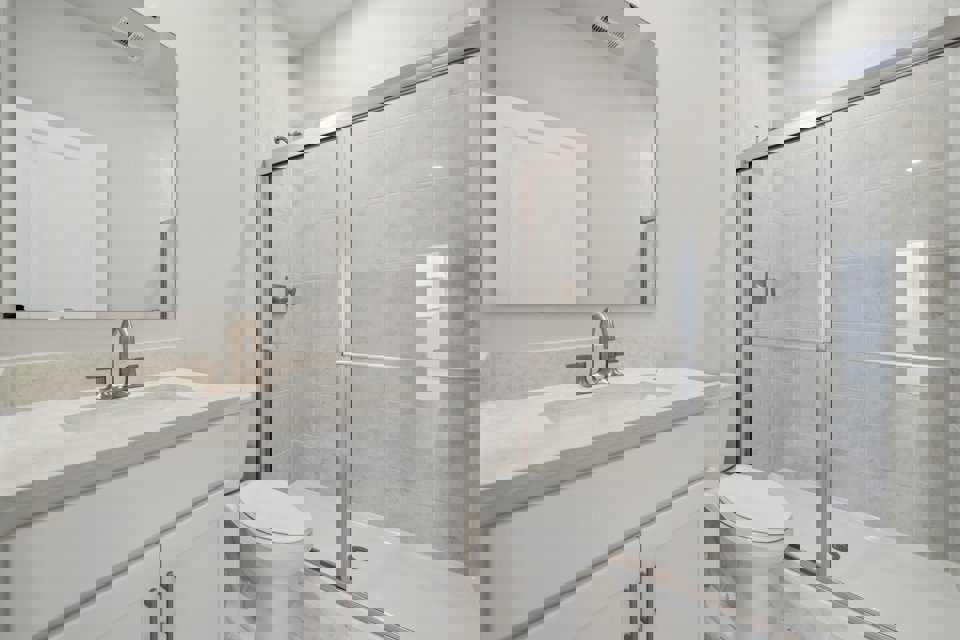 A bathroom with a glass shower.