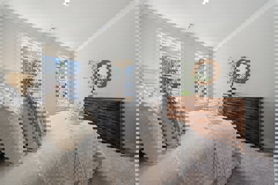 A bed with white pillows.