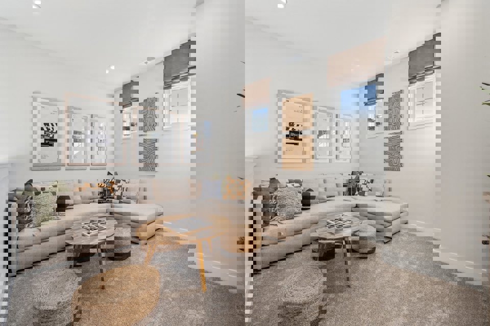 A living room with a couch and a coffee table.