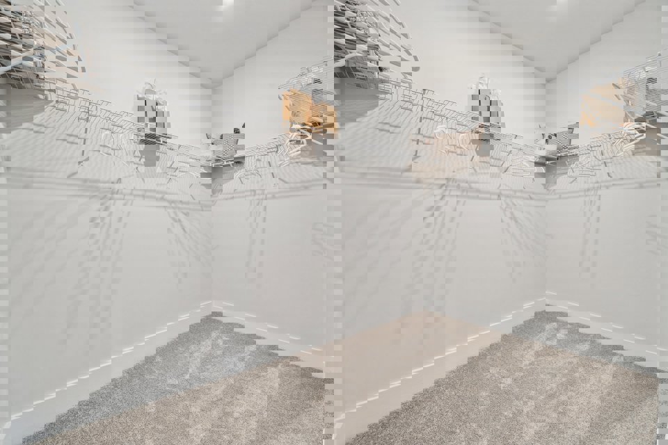 A white staircase with a white railing.