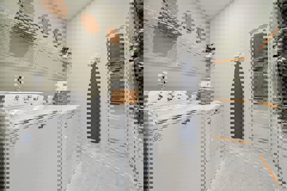 A laundry room with a washer and dryer.