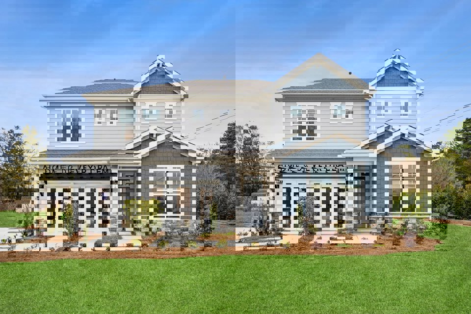 A house with a sign on the front.