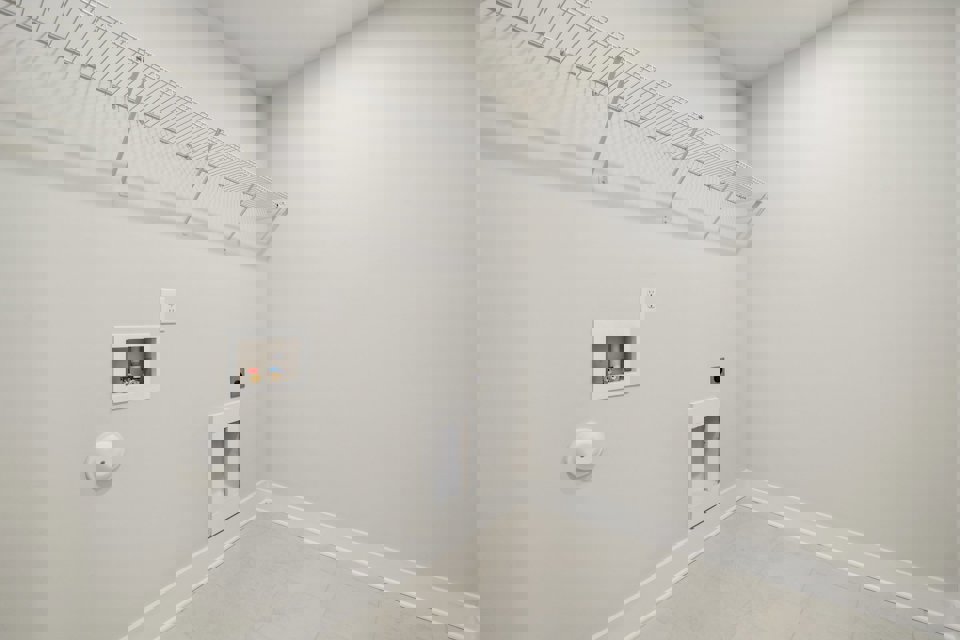 A white room with a white wall.