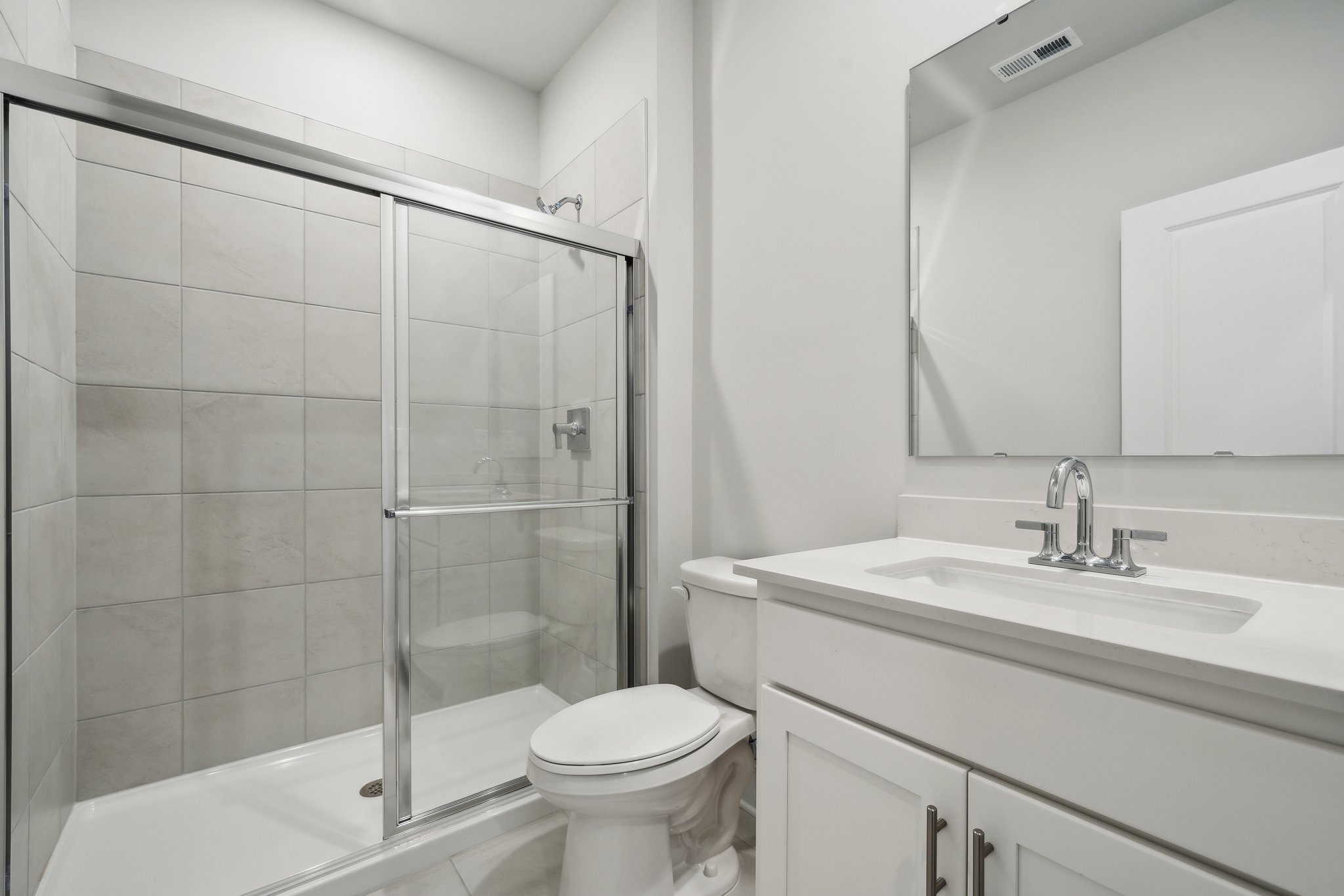 A bathroom with a glass shower.