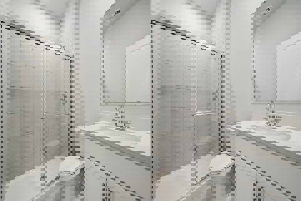 A bathroom with a glass shower.